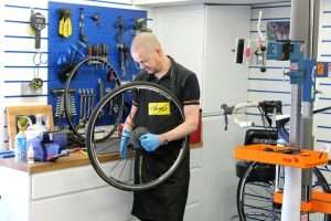 Mechanic working in a bicycle repair shop
