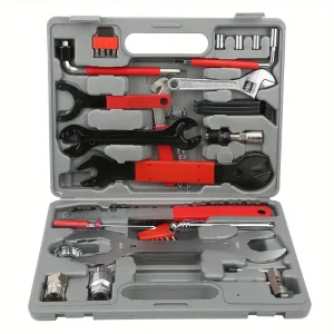 Essential bike maintenance tools including chain lube, pump, and multi-tool